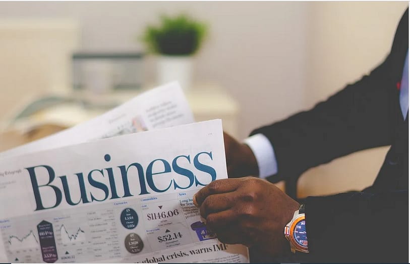 an entrepreneur reading a business magazine